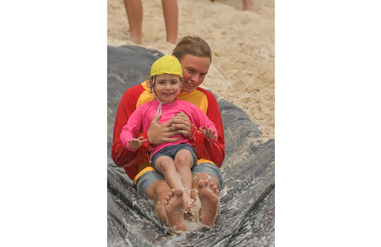 Jack Alterator makes sure the kids are safe on the beach.