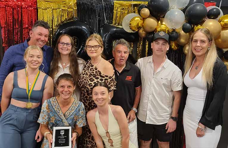 Gemma Clarke (front left) with Lady Hawks players, sponsors and coach at the recent Presentation Night. Photo: Thomas O’Keefe.