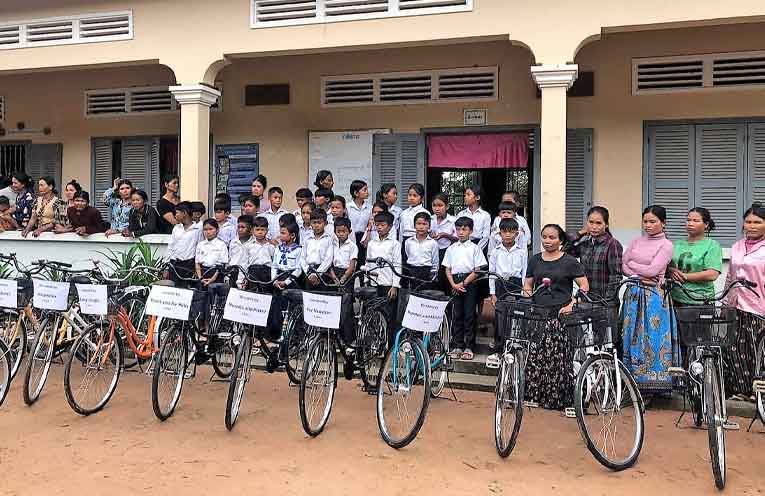 Some of the children at Romdoul school receiving donated bikes. Photo: Australia for Cambodia.
