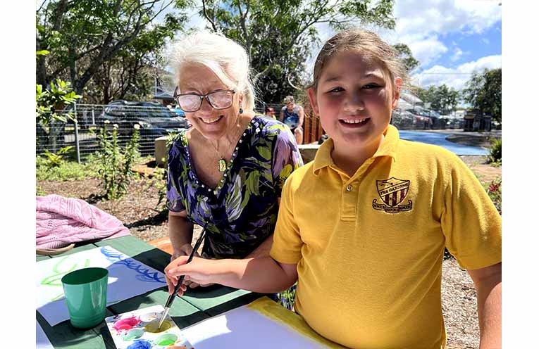 Maddie painting with her Nanna.