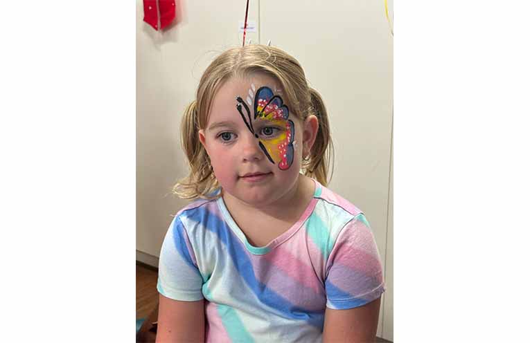 Alby showed off some of the amazing face-painting for kids. Photo: TG Lions.