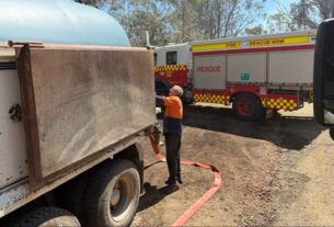 Water lifeline: Booral family steps up in Stroud blaze