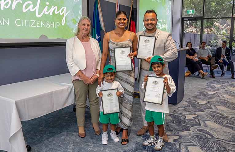 A young Adav family at the ceremony with Mayor Claire Pontin. Photo: supplied.
