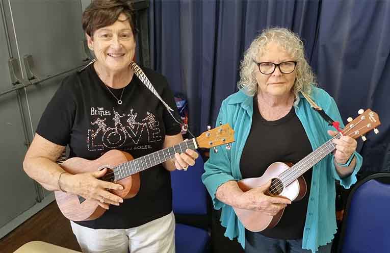 Deb and Del prepare to share the love of ukuleles and other strings.
Photos: Thomas O’Keefe.