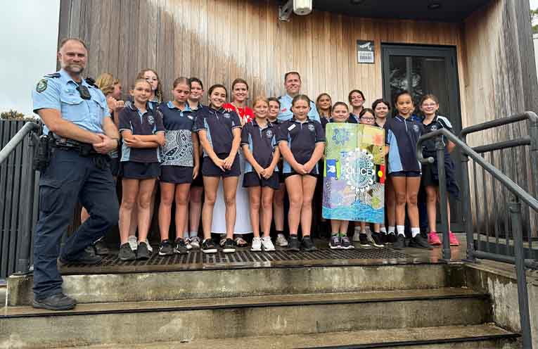 S/C Fred Saba and Inspector David Donovan with the Sista Speak students at Lemon Tree Passage police station. Photo: PSHPD.