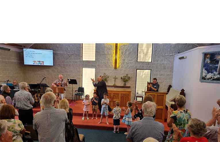 The kids always get involved with songs at the Sunday services. Photo: Thomas O’Keefe.