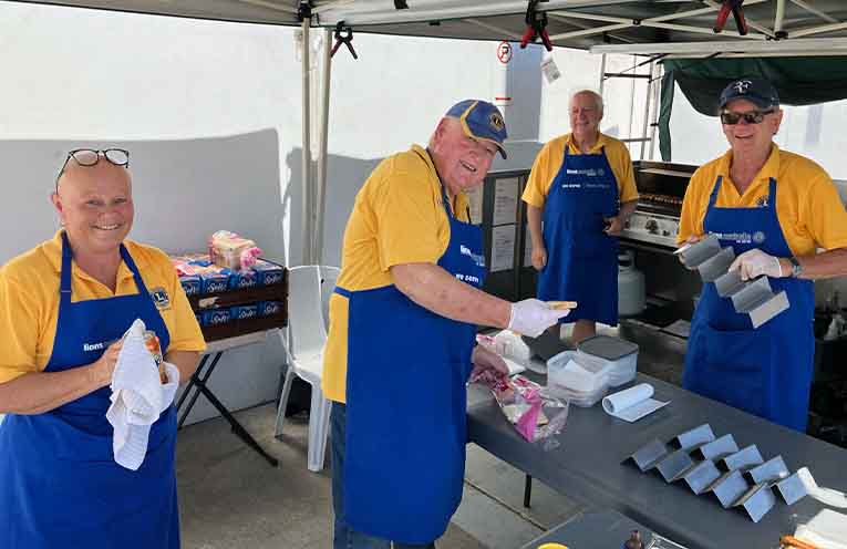 Tea Gardens Lions volunteers have mastered the art of the barbecue fundraiser. Photo: Thomas O’Keefe.