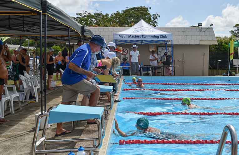 Results are recorded as swimmers reach for personal bests in Tea Gardens. Photo: Christine Dunning.