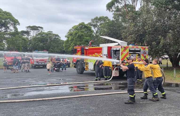 Pindimar/Tea Gardens RFS firefighters showed off their new Tatra truck and its fire-stopping power. Photo: Thomas O’Keefe.