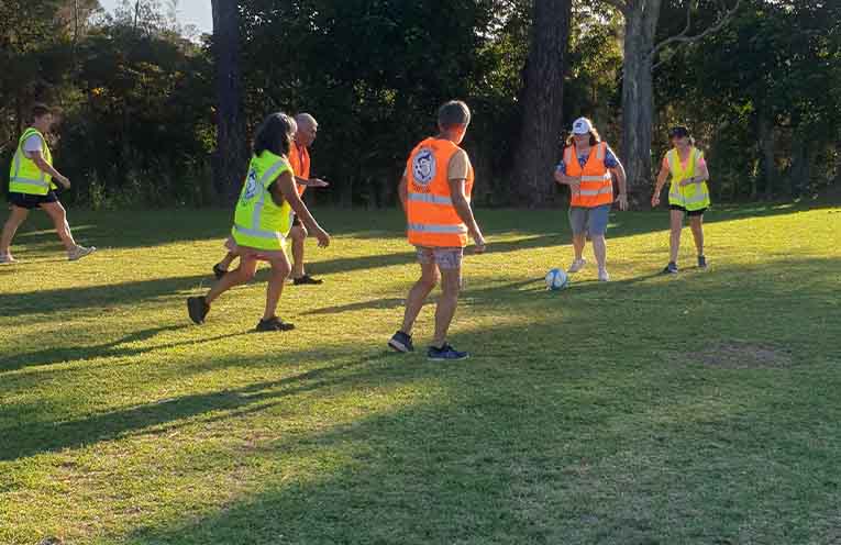 Chris lining up a pass to Robyn with George in support. Karen, Shirley and Lyn defending.