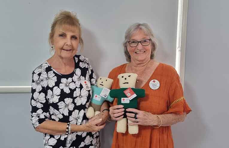 Jane and Narelle from Tea Gardens Red Cross share the comfort that Trauma Teddies bring children worldwide. Photo: Thomas O’Keefe.