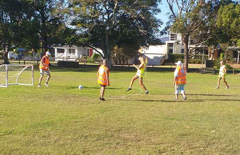 Lorraine popping one towards the net with DK defending.