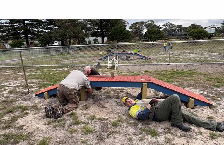 Several Lions set to work piecing together the elements of the new FOLA dog park, all made locally. Photo: Thomas O’Keefe