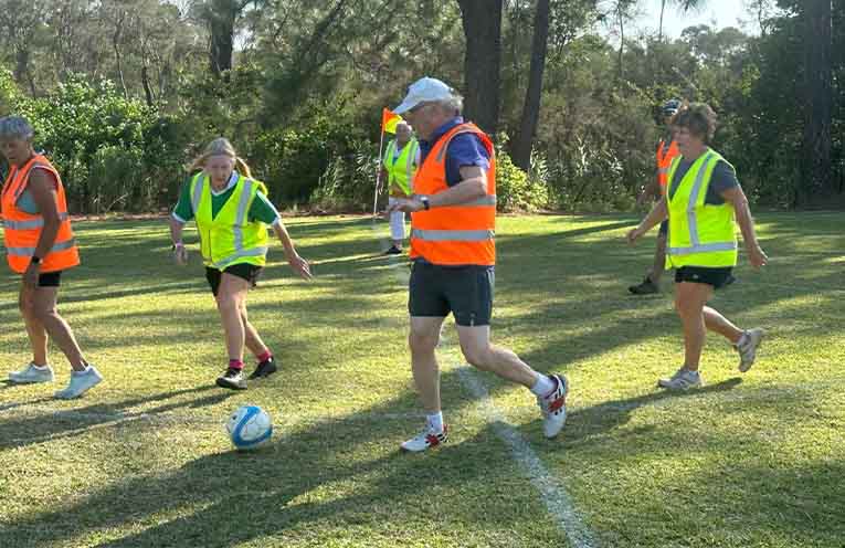 Walking football participants enjoying a fun and friendly game in the sun. Photo: supplied
