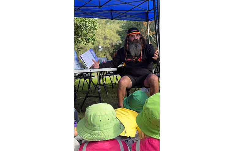 Uncle Justin Ridgeway sharing the Dreaming story of Yapii the platypus. Photo: Rachel Barry.