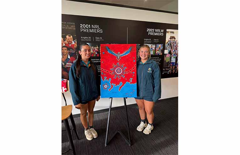 Students from Catherine McAuley Catholic College, Medowie present Newcastle Knights players with their hand-painted boots honouring Indigenous Round. Photos: CMCC Facebook.