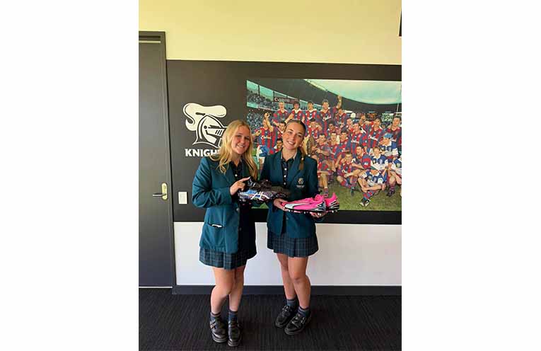 Students from Catherine McAuley Catholic College, Medowie present Newcastle Knights players with their hand-painted boots honouring Indigenous Round. Photos: CMCC Facebook.