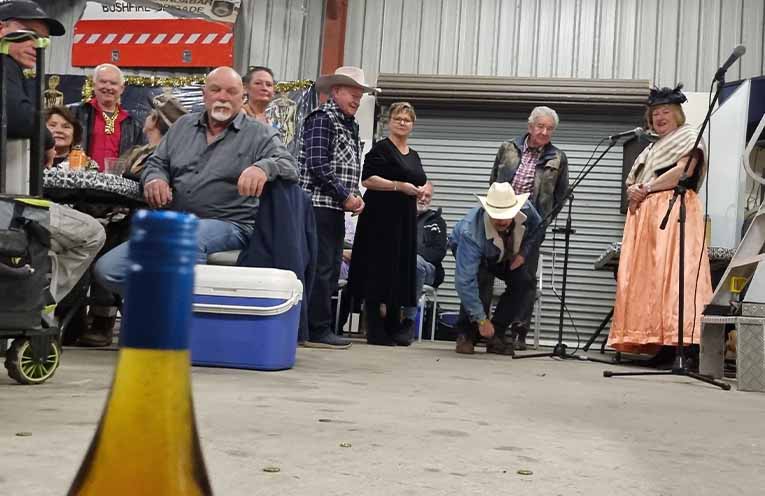 The schnapps bottle was the target for many at the coin toss. Photo: Thomas O’Keefe.