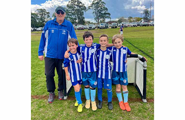 Victorious travelling under 7s team with coach Todd.