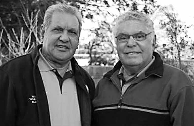 John Ridgeway and Neville Lilley were raised in the Karuah Mission and spent many hours working in oyster sheds throughout Port Stephens. Photo: Supplied by John Clarke.