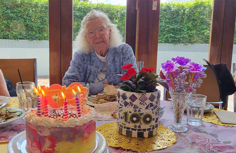 Maureen with her 100th birthday cake. Photo: Thomas O’Keefe.