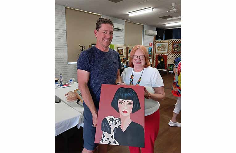 Artist Christina with art tombola winner Anthony. Photo: Jeanette Hart.
