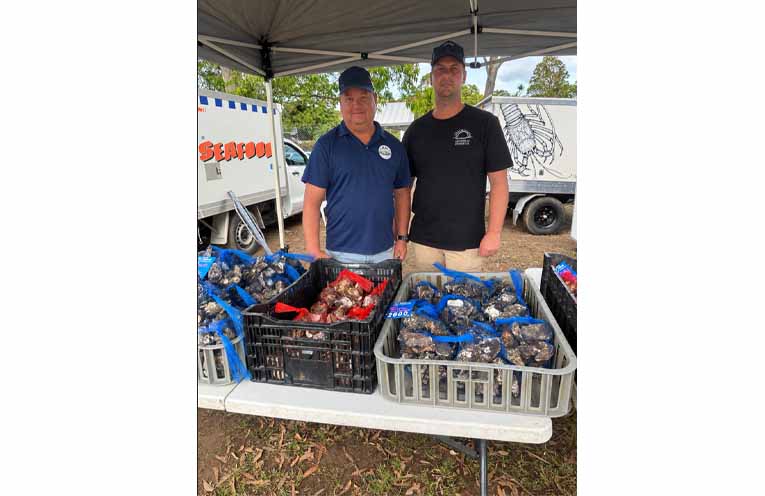 Oyster farmers Ryan Freeman and Joshua Manton with their oysters at the festival. Photo: Althea Guinsberg.