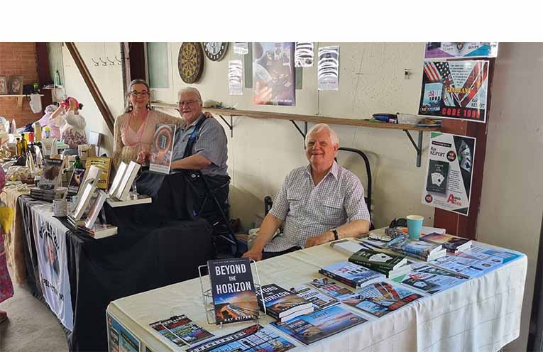 Local authors Ray Keipert and Greg Mutton, with Debbie inside. Photo: Thomas O’Keefe.