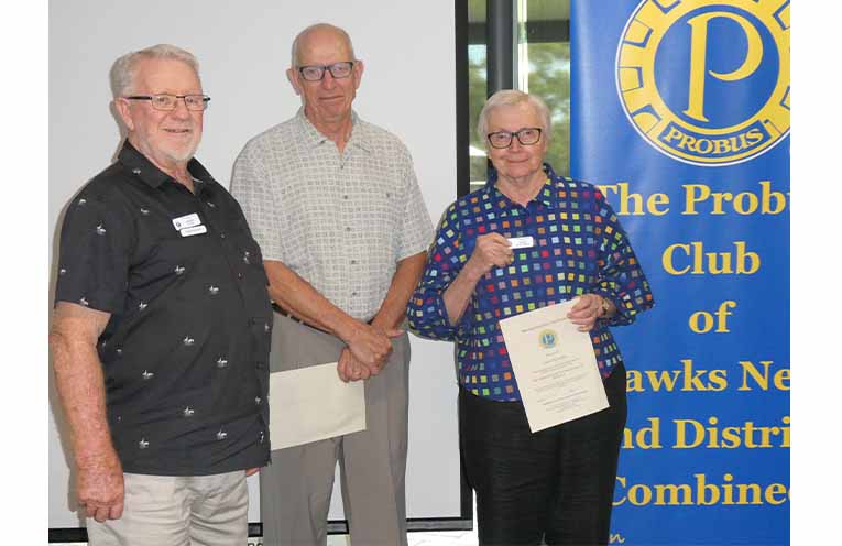 Hawks Nest Probus President John Lamb inducted new members Gordon and Joan Sutcliffe. Photo: Thomas O’Keefe.